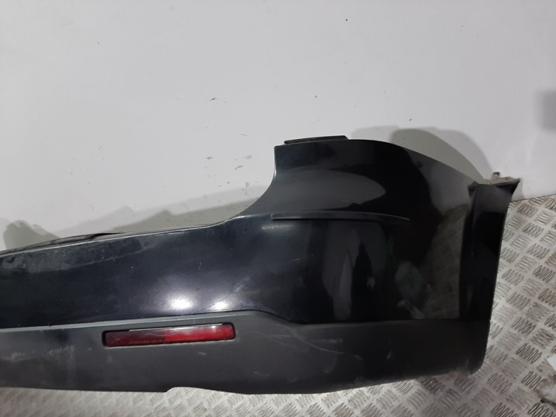 Recambio de paragolpes trasero para ssangyong kyron 200 xdi limited referencia OEM IAM 4081008B01 NEGRO 