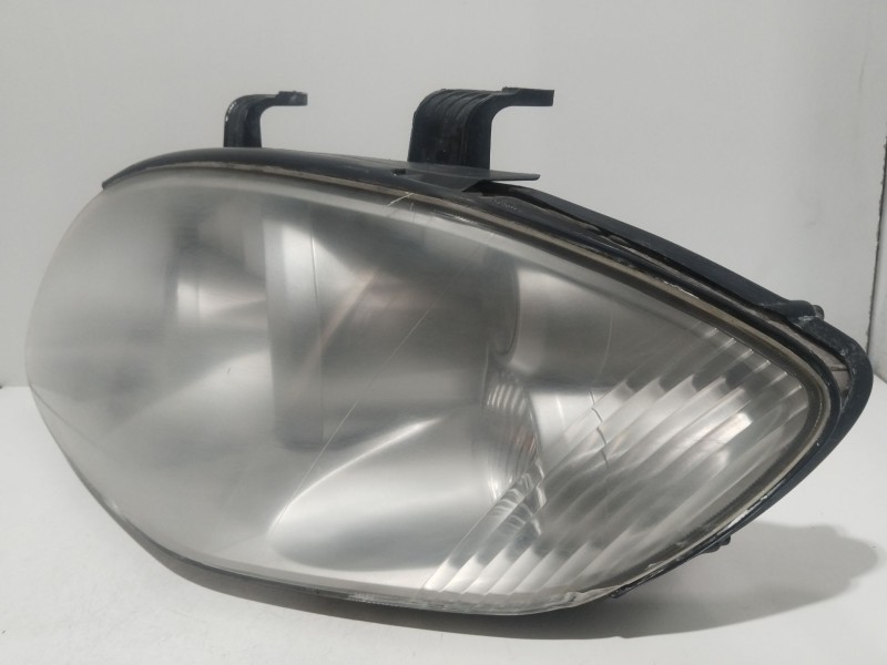 Recambio de faro izquierdo para ssangyong rodius i 2.7 xdi referencia OEM IAM 8310121201  