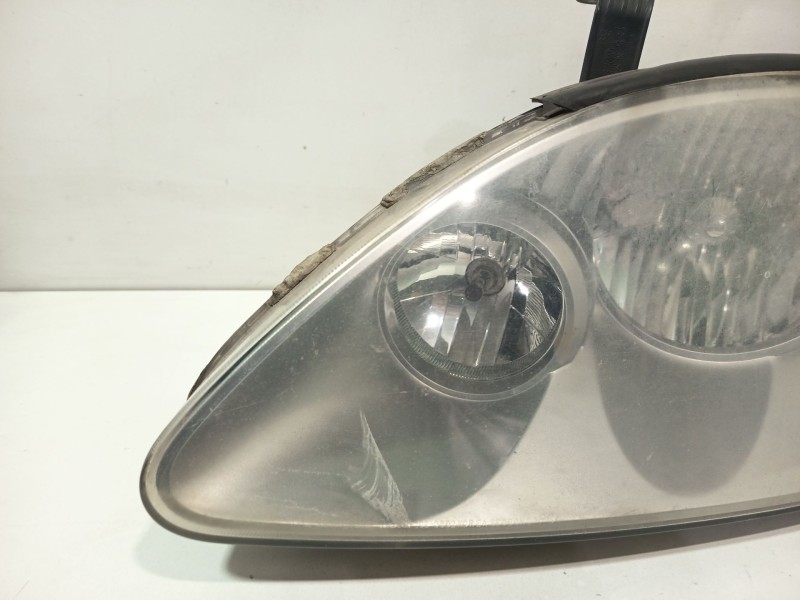 Recambio de faro izquierdo para ssangyong rodius i 2.7 xdi referencia OEM IAM 8310121201  